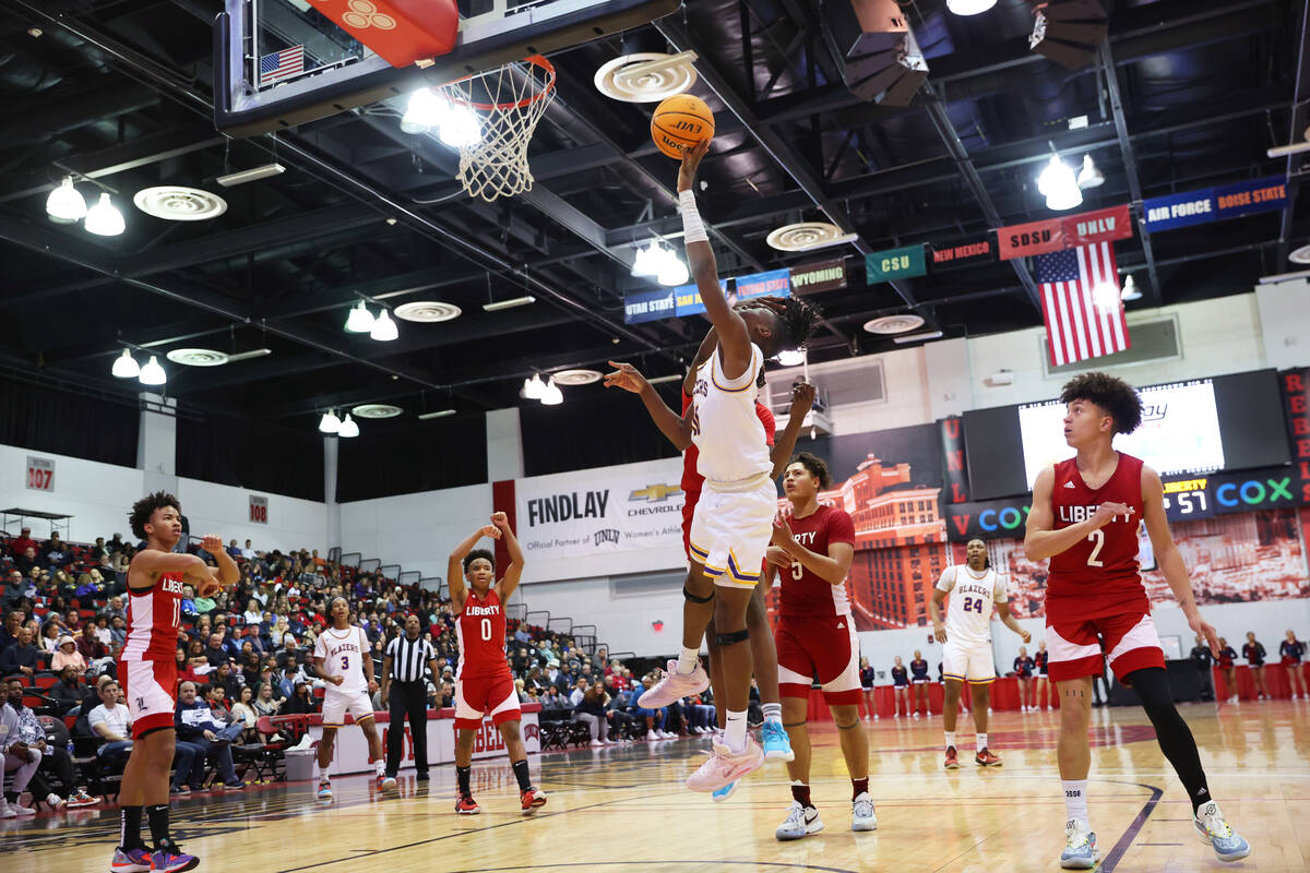 Durango's Tylen Riley (10) is fouled as he shoot a basket for a score during the second half of ...