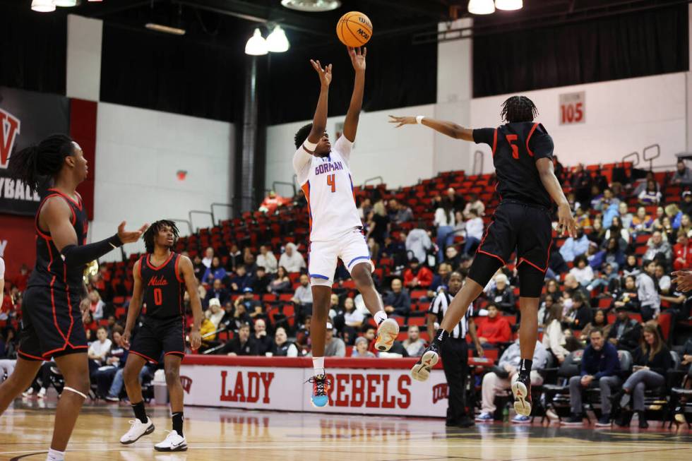 Bishop Gorman's Jase Richardson (12) shoots the ball under pressure from Coronado's Lantz Steph ...