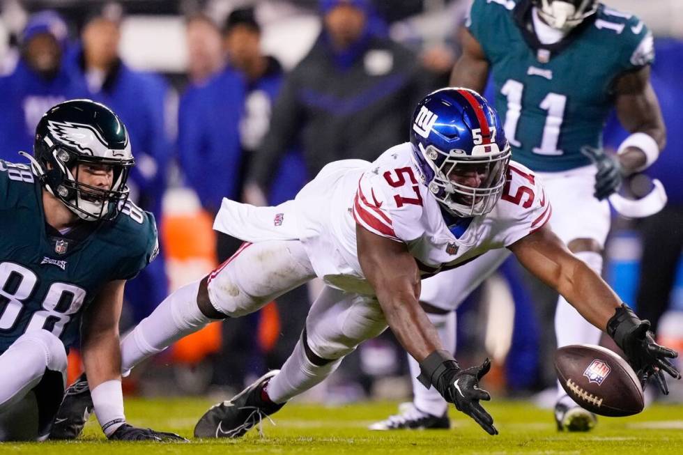 New York Giants linebacker Jarrad Davis (57) tries to intercept a pass on a broken play intende ...