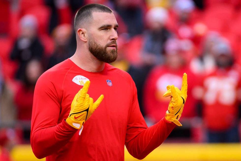 Kansas City Chiefs tight end Travis Kelce responds to the crowd's cheers during warmups before ...