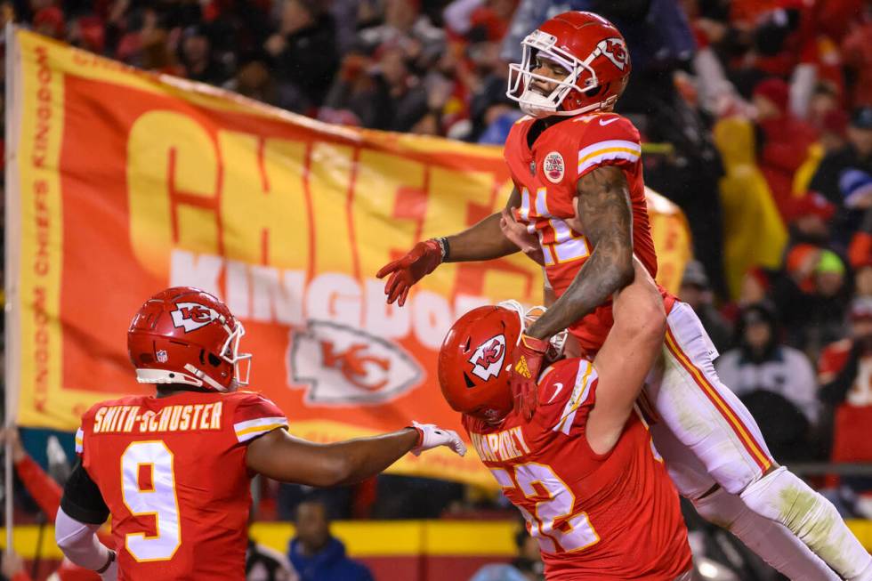 Kansas City Chiefs wide receiver Marquez Valdes-Scantling (11) gets a lift from Kansas City Chi ...