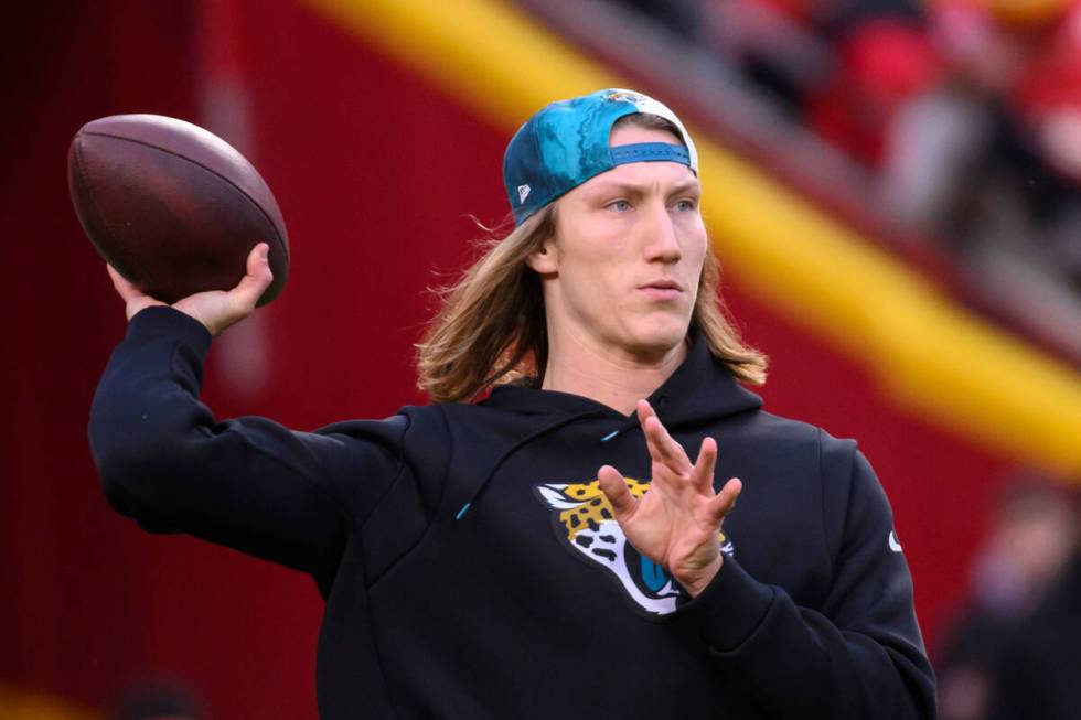 Jacksonville Jaguars quarterback Trevor Lawrence throws during warmups before an NFL divisional ...