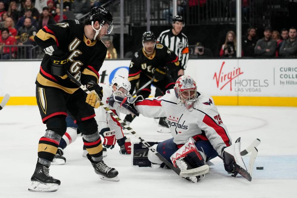 Vegas Golden Knights center Paul Cotter (43) scores past Washington Capitals goaltender Charlie ...