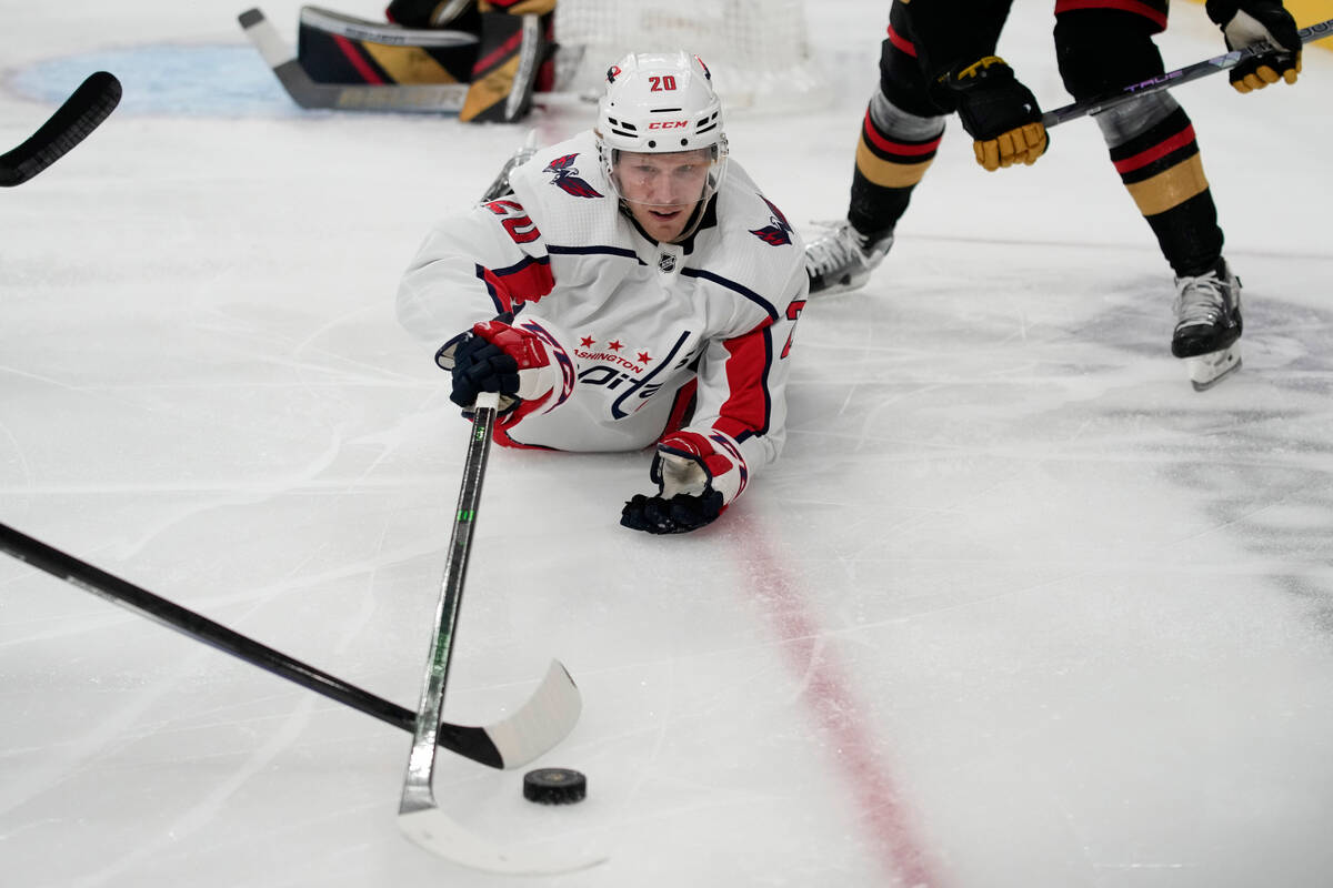 Washington Capitals center Lars Eller (20) vies for the puck against the Vegas Golden Knights d ...