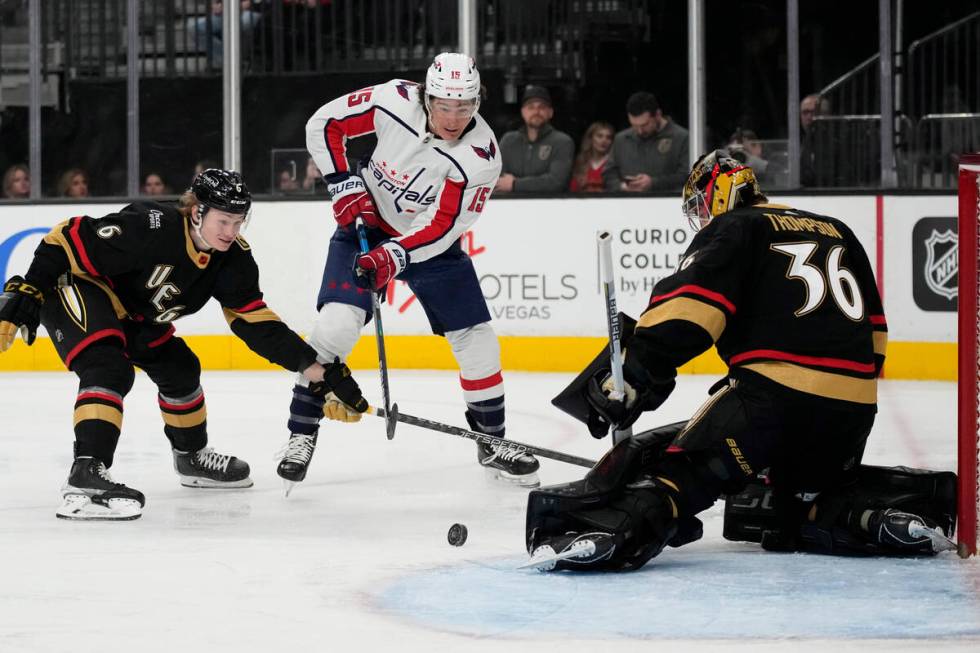 Washington Capitals left wing Sonny Milano (15) attempts a shot on Vegas Golden Knights goalten ...