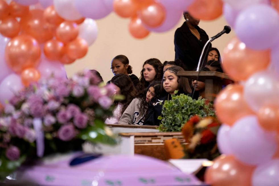 Classmates and friends of Ashari Hughes are seated in a special section during a memorial at Ne ...