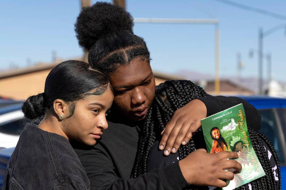 Caniya McZeal, left, Janiya Jones and Kaylea Shelby, classmates and friends of Ashari Hughes, e ...