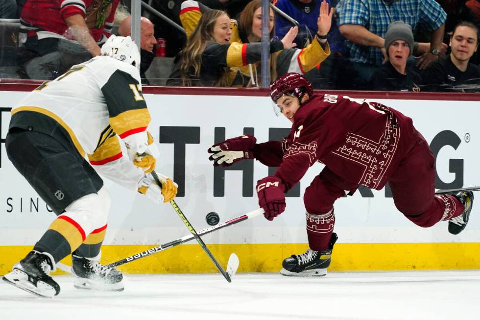 Vegas Golden Knights defenseman Ben Hutton (17) passes the puck against Arizona Coyotes right w ...