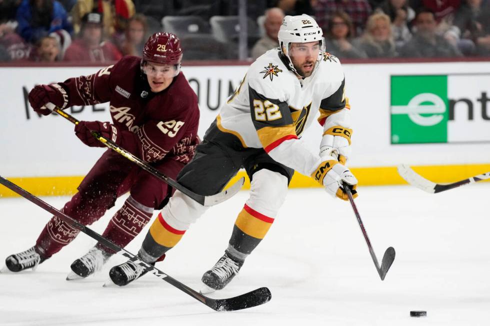 Vegas Golden Knights right wing Michael Amadio (22) skates with the puck in front of Arizona Co ...