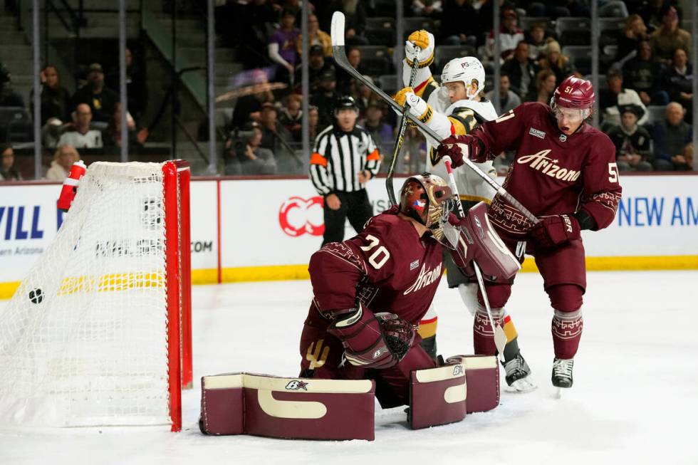 Arizona Coyotes goaltender Karel Vejmelka (70) gives up a goal to Vegas Golden Knights' Phil Ke ...