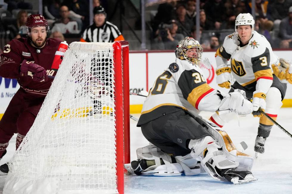 Vegas Golden Knights goaltender Logan Thompson (36) makes a save against a shot by Arizona Coyo ...