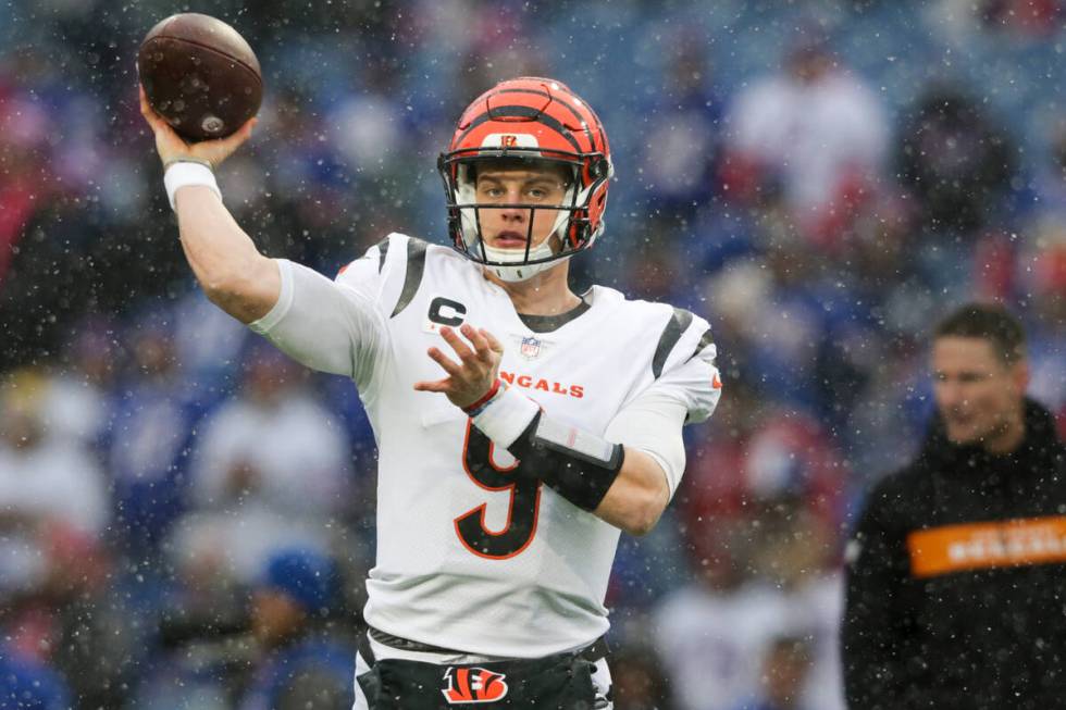 Cincinnati Bengals quarterback Joe Burrow (9) warms up before playing against the Buffalo Bills ...