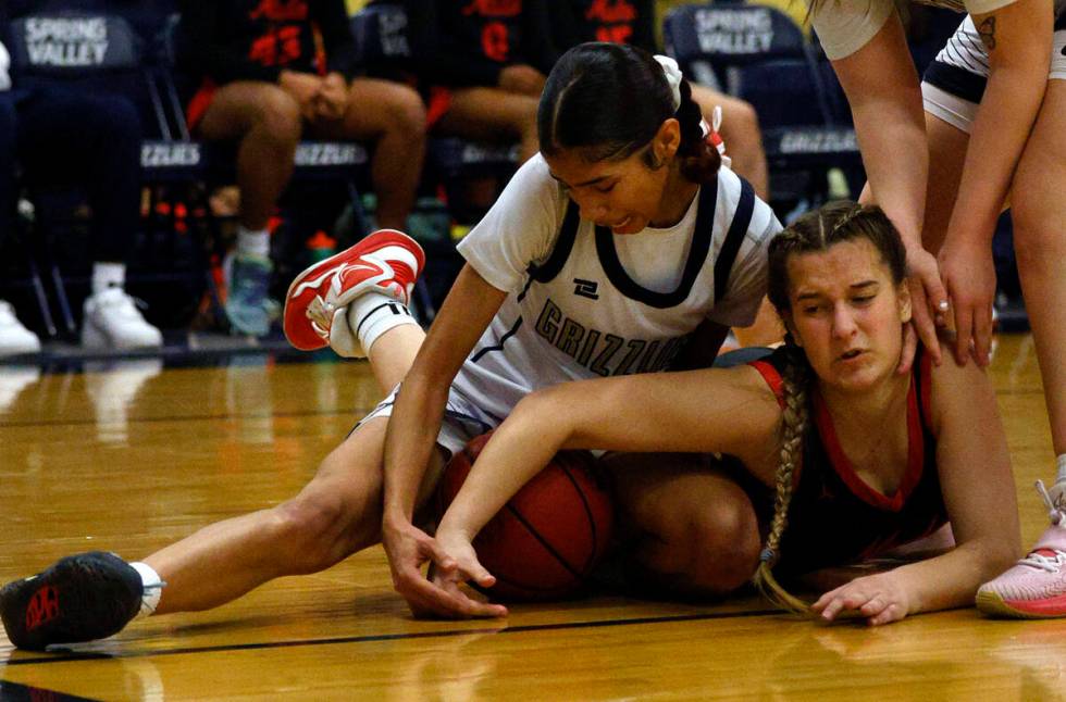 Spring Valley's Charolette Delisle (21) and Coronado's Savannah Lopez (4) battle for a loose ba ...