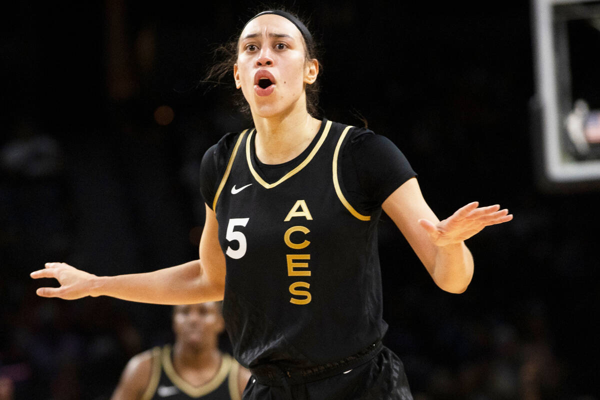 Aces forward Dearica Hamby (5) argues a call in the first half of a WNBA basketball game agains ...