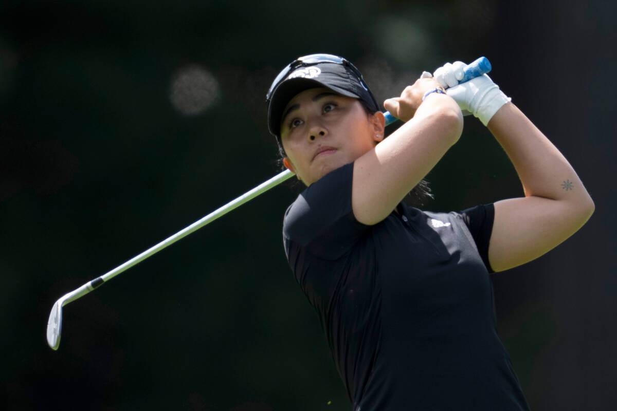 Danielle Kang, from the United States, watches an approach shot on the 3rd hole during the thir ...