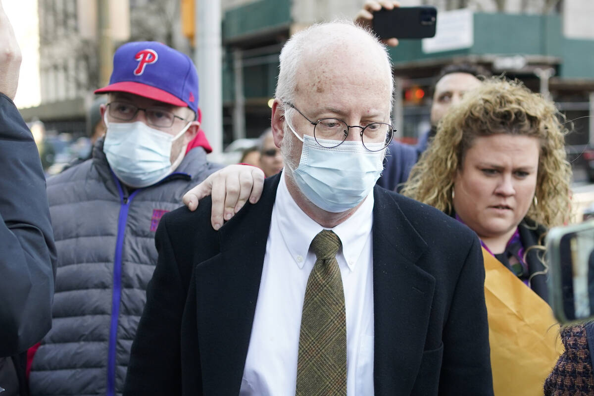 Robert Hadden, center, leaves the federal courthouse in New York on Tuesday, Jan. 24, 2023. Had ...