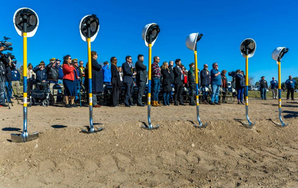 Attendees stand for the Pledge of Allegiance during a groundbreaking ceremony at the Southern N ...