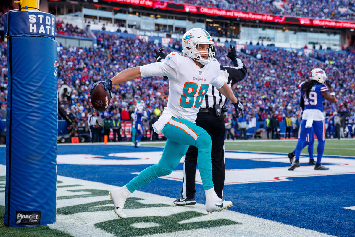 Miami Dolphins tight end Mike Gesicki (88) celebrates after catching a touchdown pass during an ...
