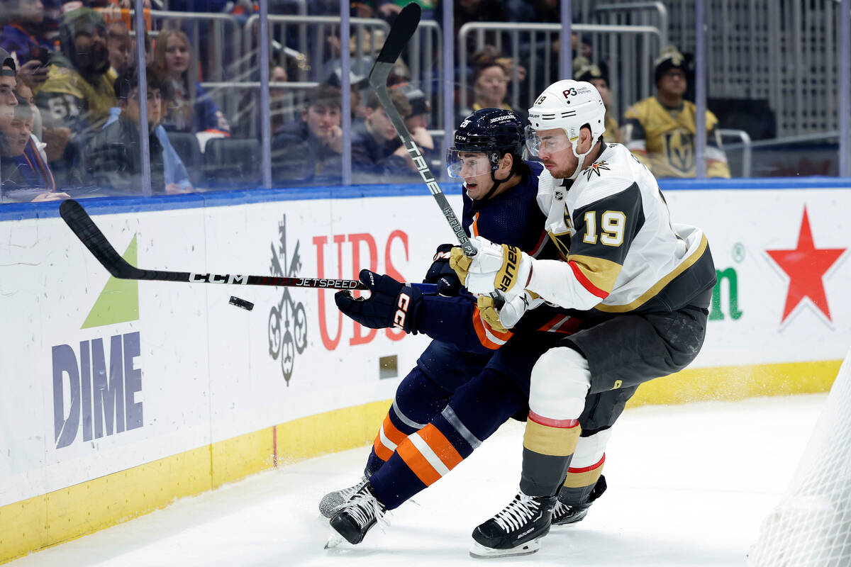 New York Islanders defenseman Alexander Romanov and Vegas Golden Knights right wing Reilly Smit ...