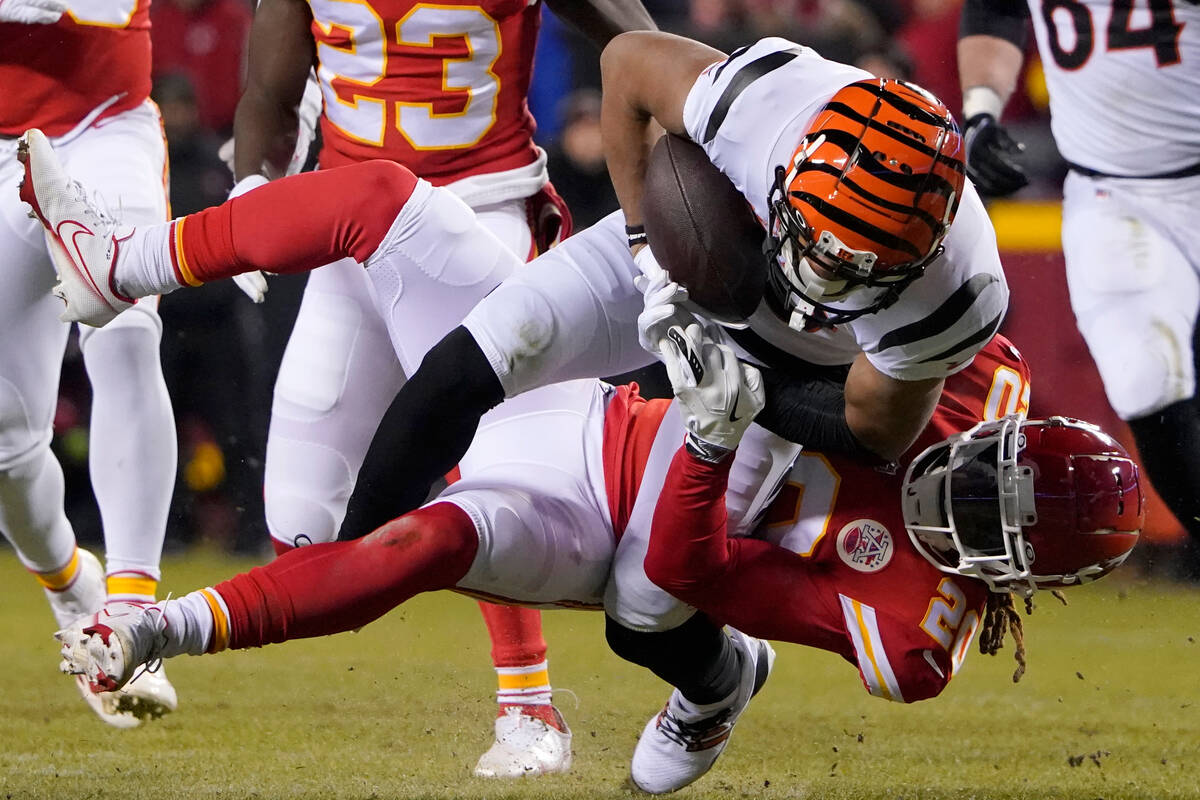 Kansas City Chiefs safety Justin Reid (20) tackles Cincinnati Bengals wide receiver Tyler Boyd ...