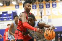 Desert Pines' Kameron Ricks (1) drives the ball as Coronado's Sebastian Mack (12) defends durin ...