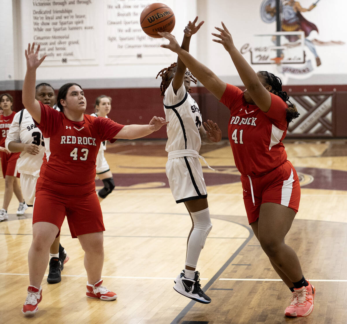 Doral’s Nyema Watkins (41) shoots while Cimarron-Memorial’s Dazani Graham, center ...