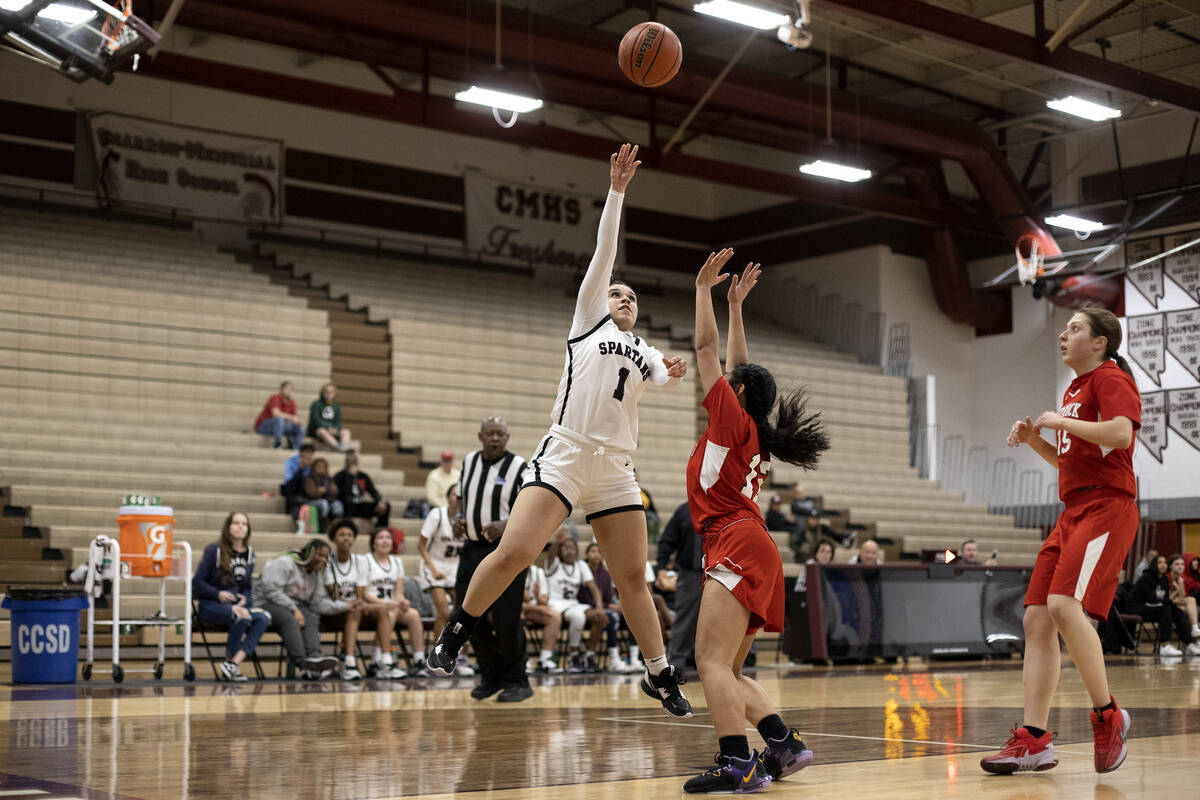 Cimarron-Memorial’s Natalia Godoy (1) shoots against Doral’s Autumn Maefau (12) d ...