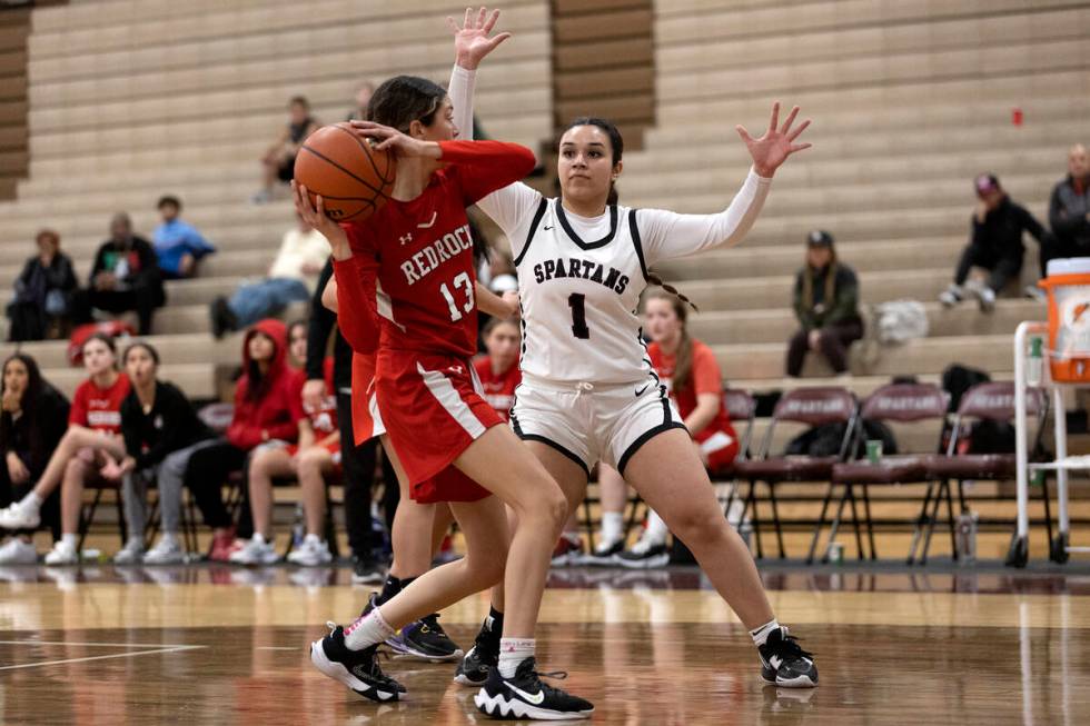 Doral’s Peyton Gomez (13) looks for a teammate to pass to while Cimarron-Memorial&#x2019 ...