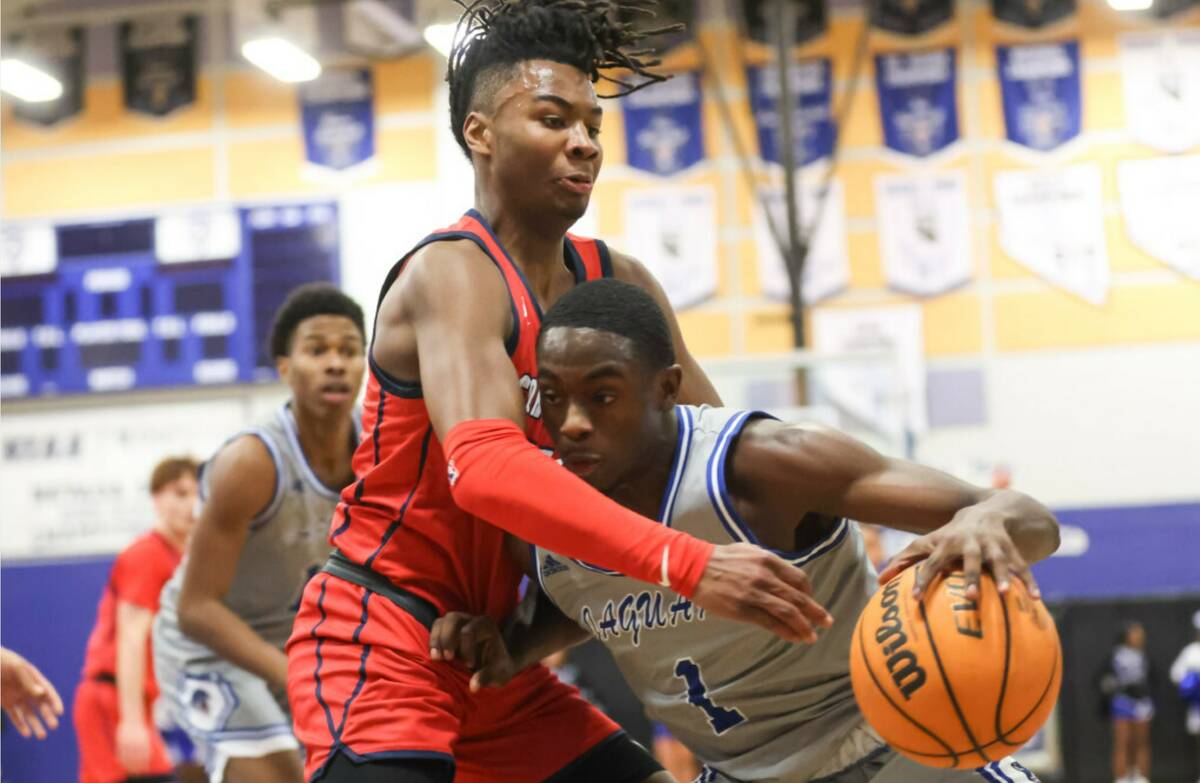 Desert Pines' Kameron Ricks (1) drives the ball as Coronado's Sebastian Mack (12) defends durin ...