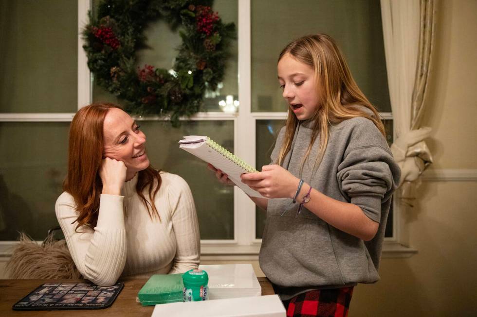 Ann Mabeus laughs with her daughter Bree-Ann Mabeus, 11, as she reads from her schoolwork. (Rac ...