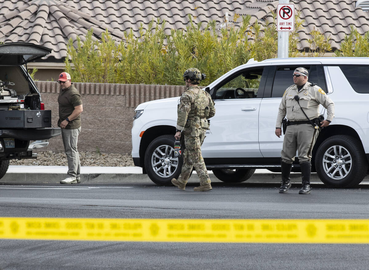 A SWAT team arrives where Las Vegas police are assisting the Federal Bureau of Investigation in ...