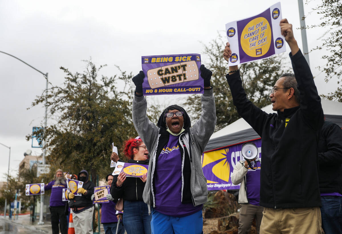 Theresa McGowan, SEIU Local 1107 ancillary steward, left, and Felipe Danglapin, an SEIU staff m ...