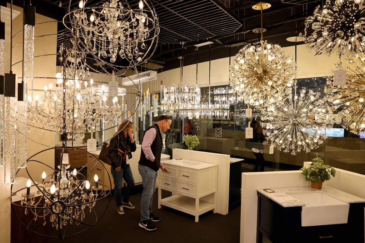 Conventioneers browse in the Elegant Furniture & Lighting showroom during the biannual Las Vega ...