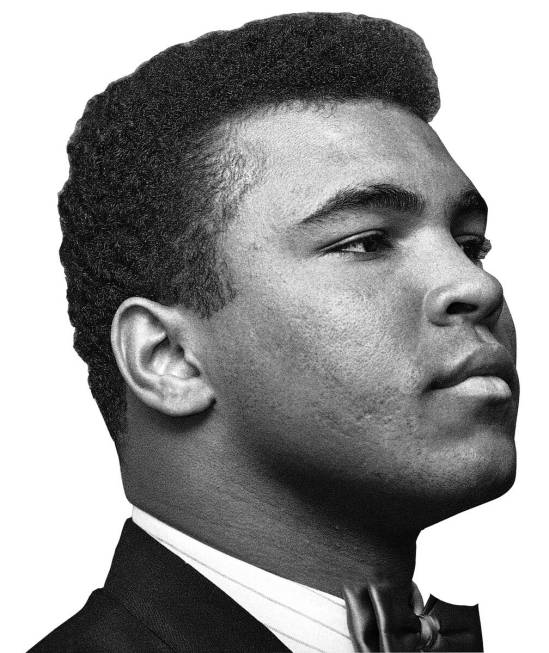 Muhammad Ali, heavyweight champion, buttons his lip as he appears before Illinois Athletic Comm ...