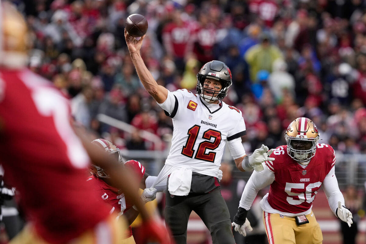 FILE - Tampa Bay Buccaneers quarterback Tom Brady (12) passes the ball as San Francisco 49ers c ...