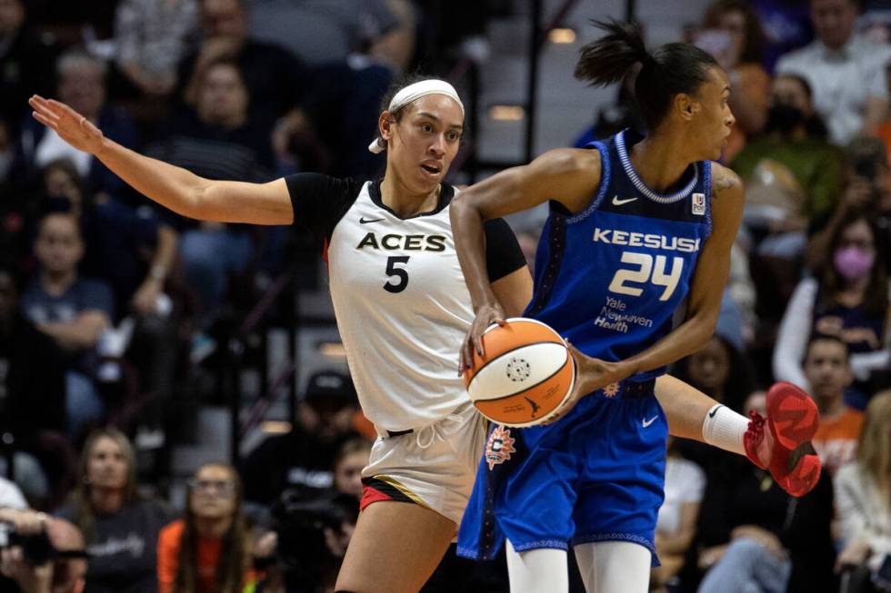 Las Vegas Aces forward Dearica Hamby (5) takes up space to guard Connecticut Sun forward DeWann ...