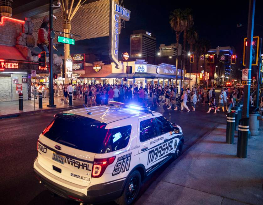 Deputies with the Las Vegas Marshals Office park outside the Fremont Street Experience on Satur ...