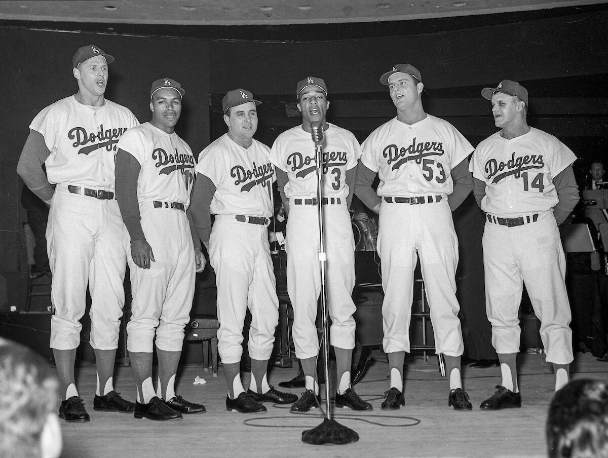 Joey Bishop performs on stage with Los Angeles Dodgers, from left, Frank Howard (25), Tommy Dav ...