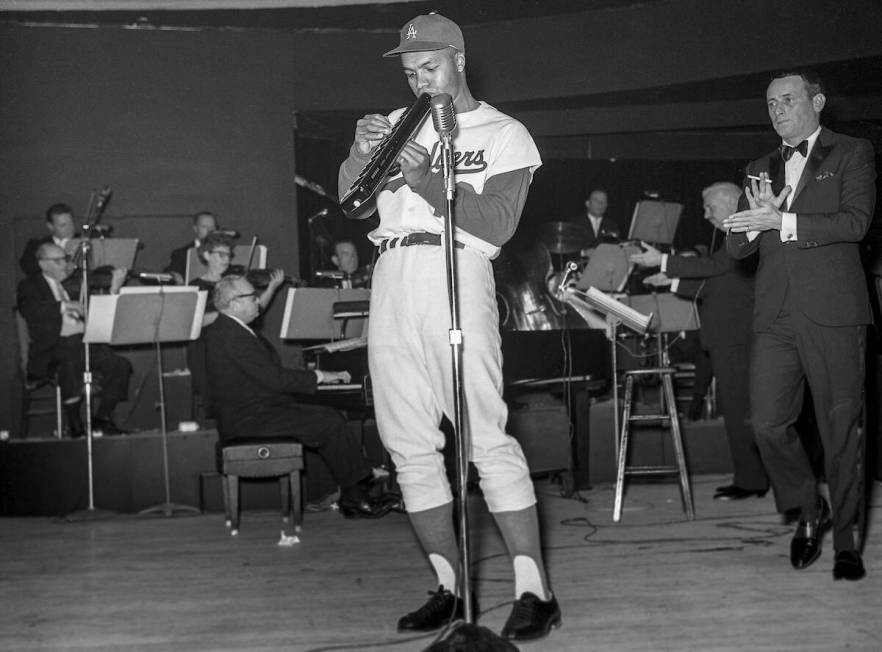 Los Angeles Dodgers Tommy Davis (12) plays a melodica while performing with other Dodgers and J ...