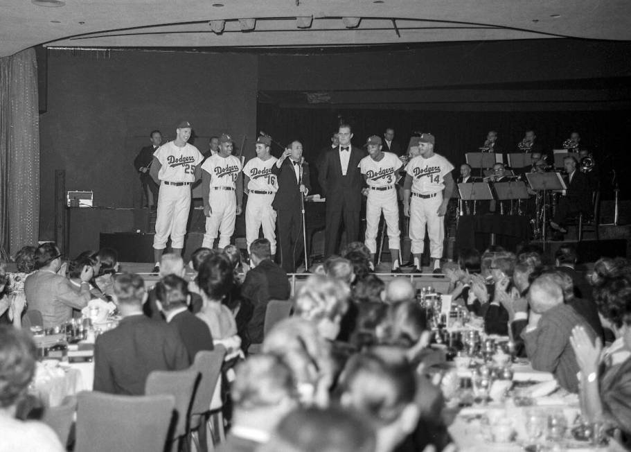 Joey Bishop performs on stage with Los Angeles Dodgers, from left, Frank Howard (25), Tommy Dav ...