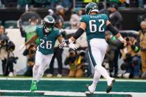 Philadelphia Eagles running back Miles Sanders (26) celebrates his touchdown with center Jason ...