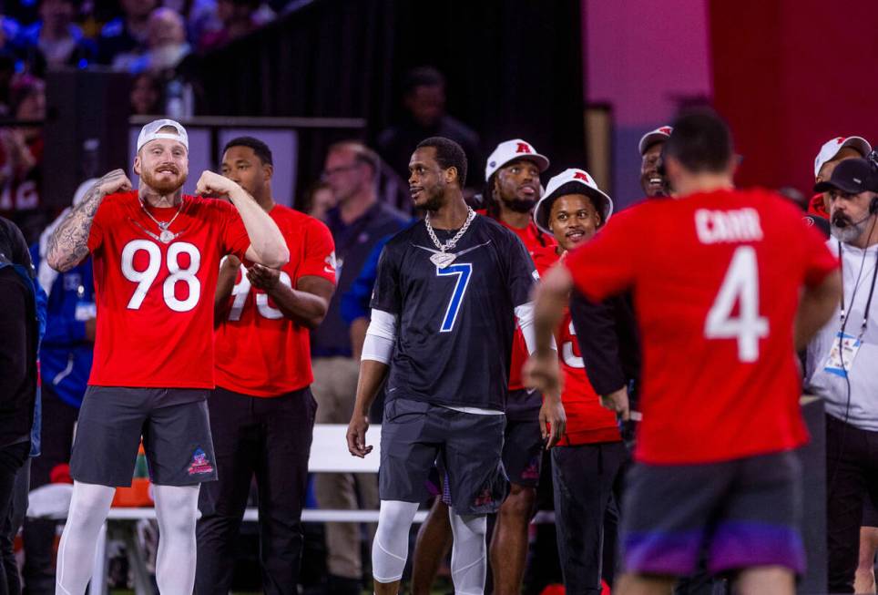 The AFC's Maxx Crosby (98) of the Raiders is pumped as Derek Carr (4, right) with the Raiders ...