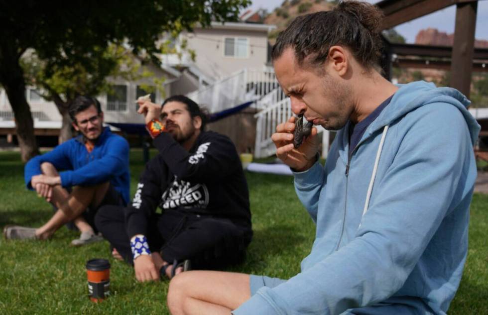 Michael Vasconez, a facilitator with Hummingbird Church, blows a sacred tobacco snuff used by s ...