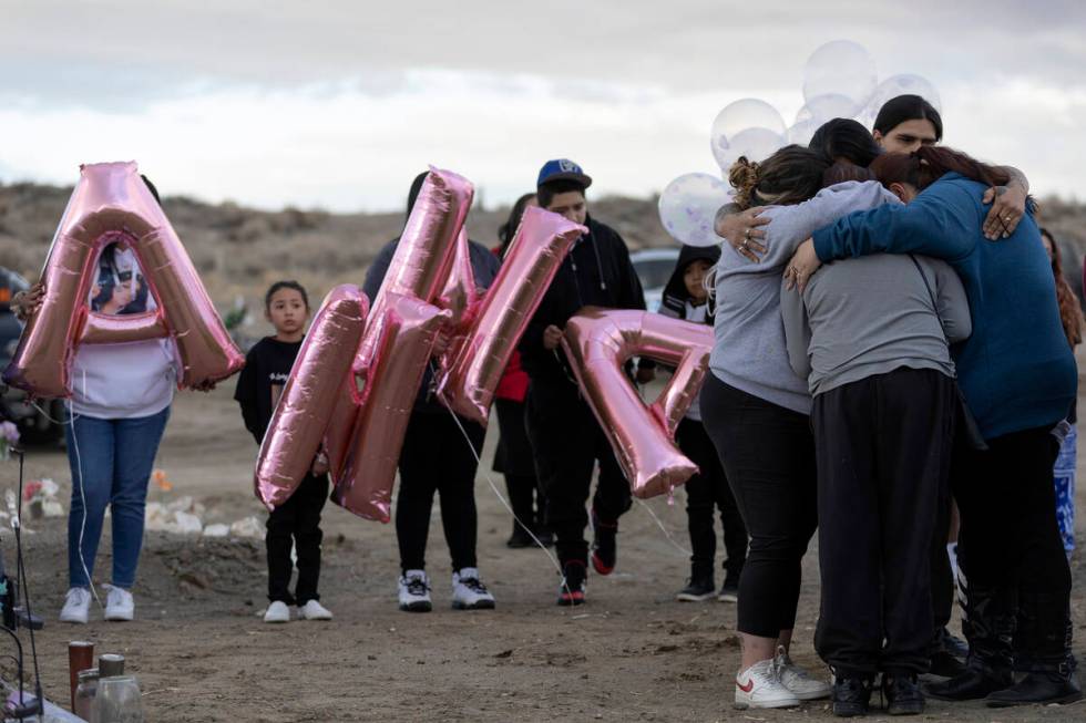 The family of Anna Scott, a member of the Pyramid Lake Paiute Tribe, embrace during a memorial ...