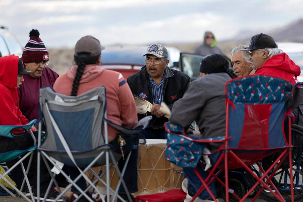 Terry Wright, center, who operates the local sweat lodge, participates in a drum circle for Ann ...