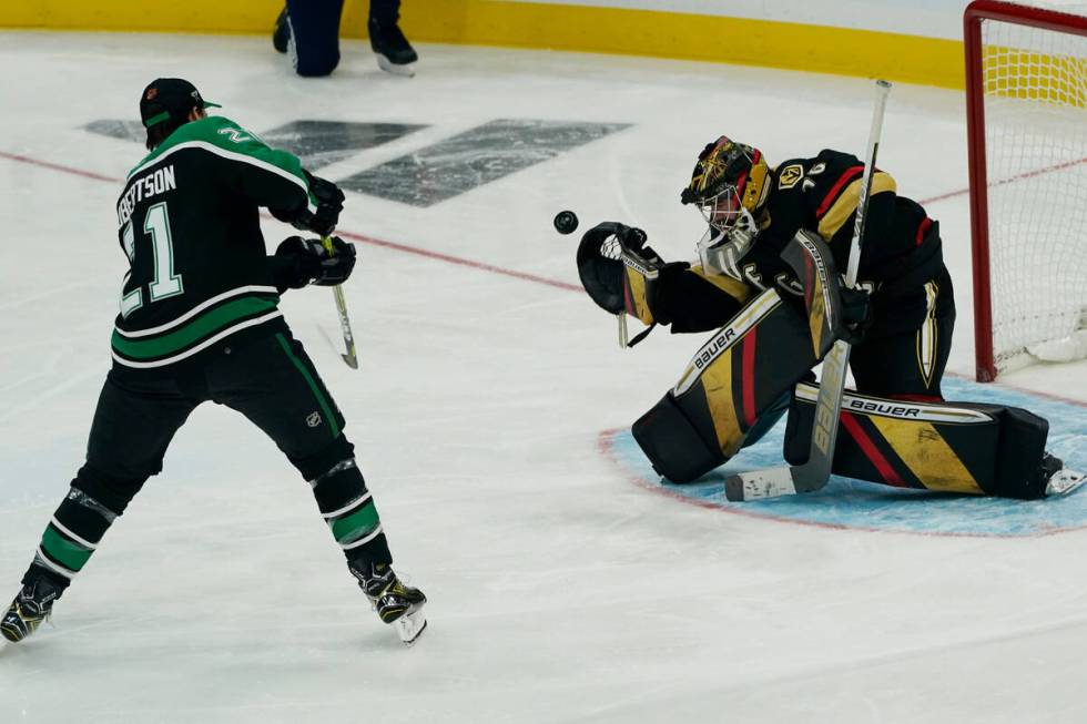 Las Vegas Golden Knights goaltender Logan Thompson (36) stops a shot on goal by Dallas Stars' J ...