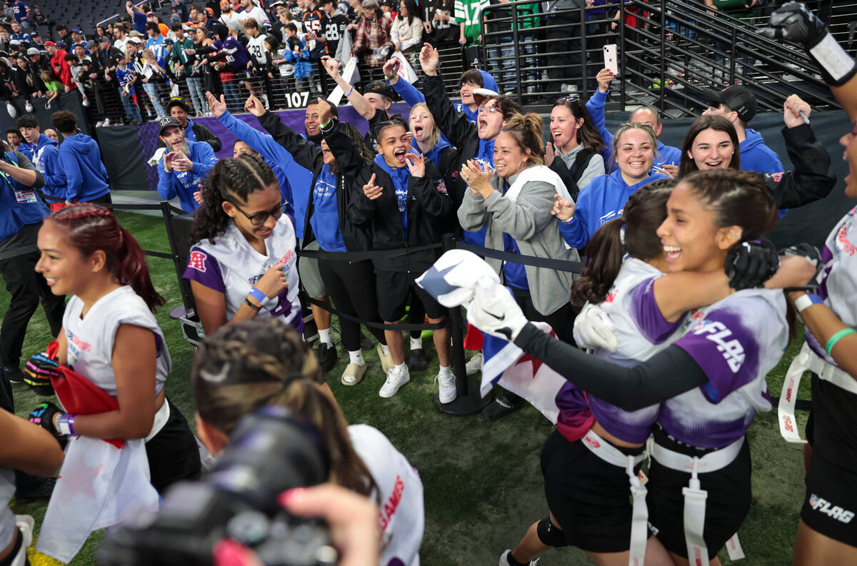 Members and family of the 507 Devils girls flag football team from Panama celebrate after winni ...