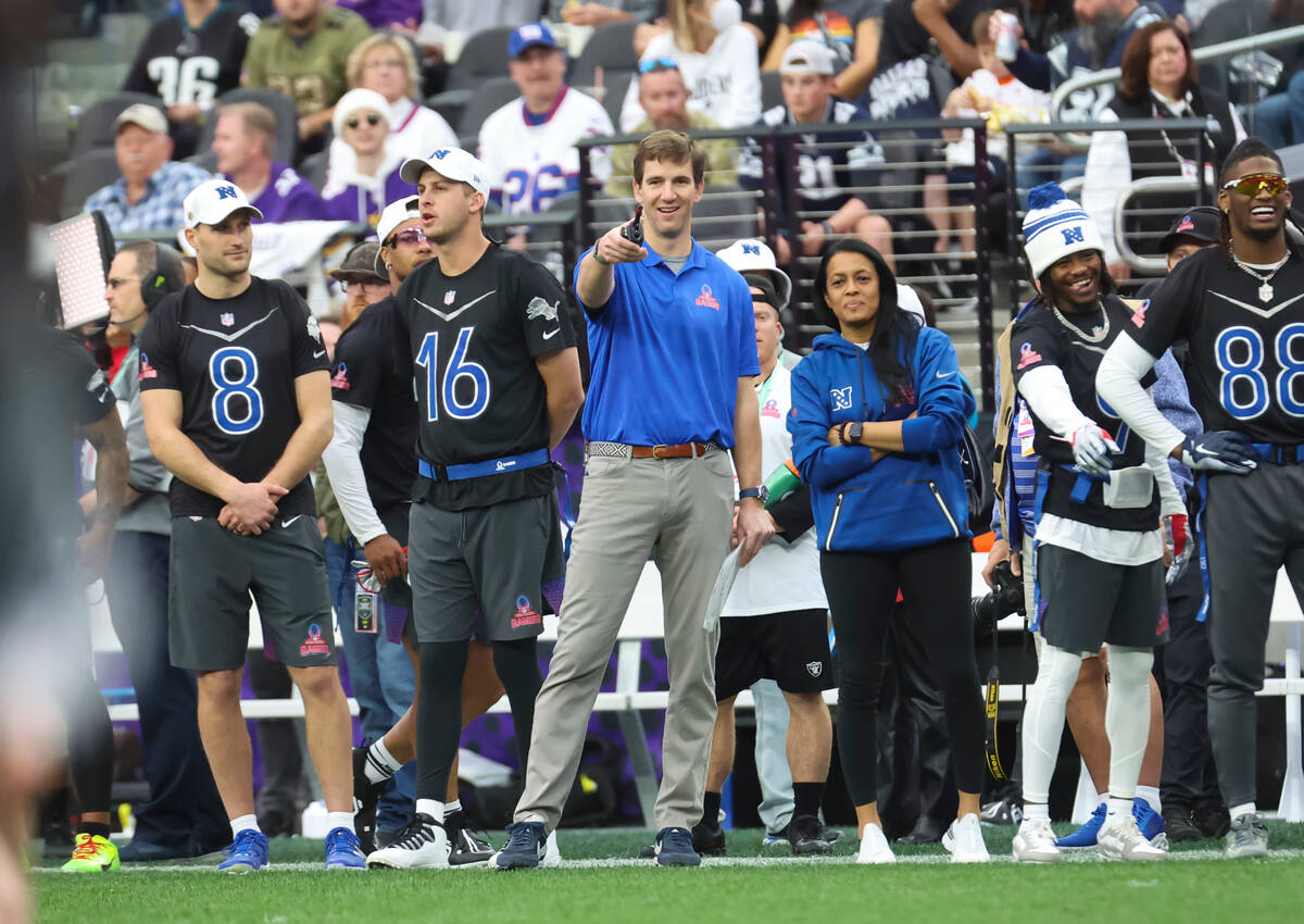 NFC head coach Eli Manning motions to the field during the NFL Pro Bowl Games at Allegiant Stad ...