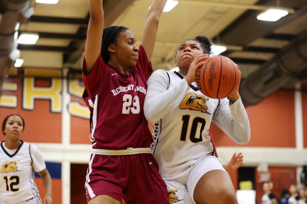 Desert Oasis' Madison Pescado (23) defends the ball against Clark's Sarah Upshaw (10) during a ...