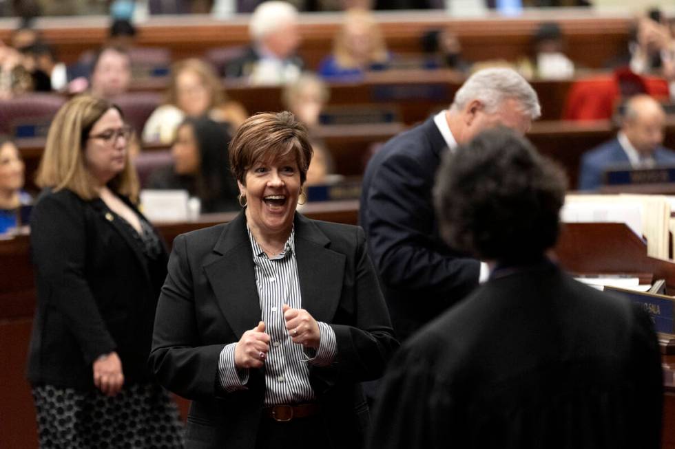 Assemblywoman Tracy Brown-May, D-Las Vegas, greets Chief Justice Lidia S. Stiglich after signin ...